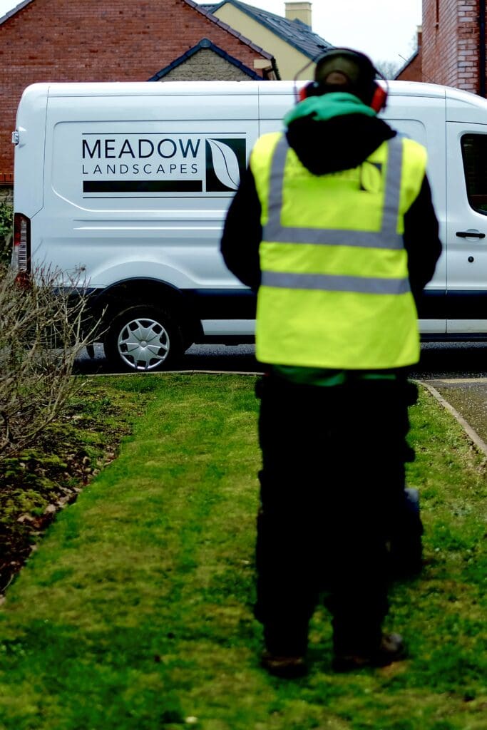 Meadow Landscapes cutting grass with van in background